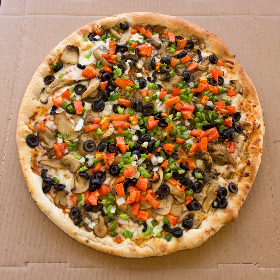 A large, round vegetarian pizza with mushrooms, black olives, red and green bell peppers, and onions.